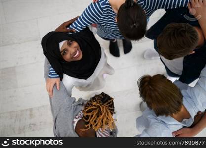 a top view of  diverse group of people standing embracing and symbolizing togetherness 