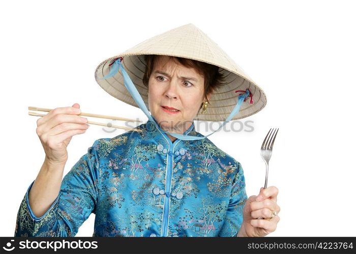 A tourist in Chinatown deciding whether to eat with chopsticks or a fork. Isolated on white.