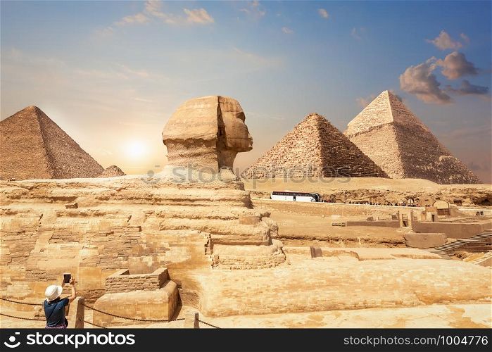 A tourist in Giza enjoying the Sphinx and the Pyramids, Egypt.. A tourist in Giza enjoying the Sphinx and the Pyramids, Egypt