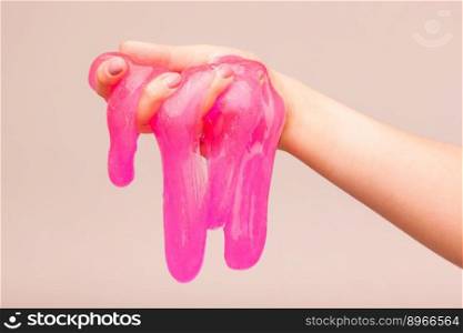 a toy for children mucus and liquid flowing on hand