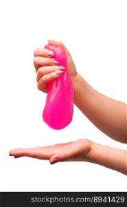 a toy for children mucus and liquid flowing on hand on a white background