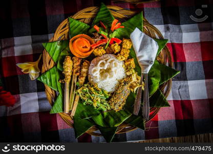 A traditional Balinese meal of rice, currie, vegetables an chicken.