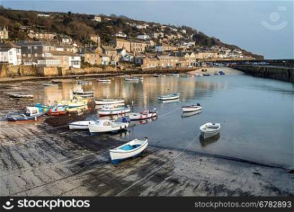 A traditional Cornish fishing village and harbor Cornwall England