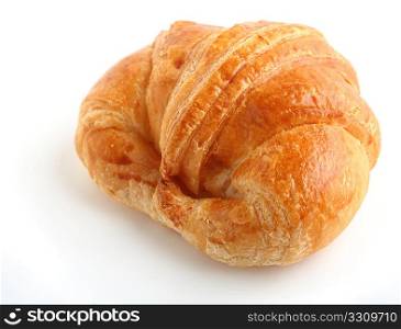 A traditional croissant bread roll over a white background with a light shadow.
