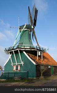A Traditional Dutch windmill in the quaint village of Zaanse Schans, the Netherlands