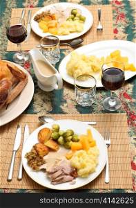 A traditional festive dinner of turkey, roast and boiled potatoes, brussels&acute; sprout, swede, stuffing and gravy