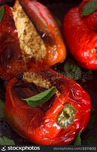 A traditional North African/Middle Eastern vegetarian meal of baked capsicums stuffed with cous-cous (steamed durum wheat semolina granules) mixed with mint and raisins.