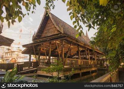 a traditional thai woodhouse with garden at the Maenam river in the city of Phitsanulok in the north of Thailand. Thailand, Phitsanulok, November, 2018.. THAILAND PHITSANULOK CITY WOOD HOUSE
