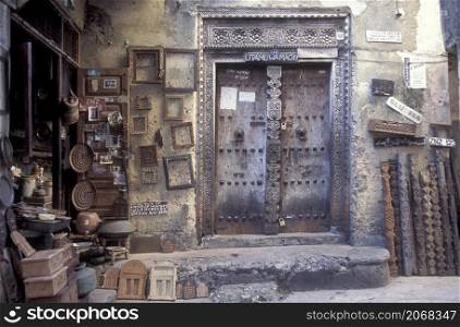 a traditional Wood Door in the Old Town of Stone Town on the Island of Zanzibar in Tanzania. Tanzania, Zanzibar, Stone Town, October, 2004