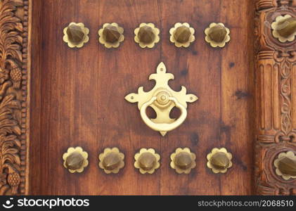 a traditional Wood Door in the Old Town of Stone Town on the Island of Zanzibar in Tanzania. Tanzania, Zanzibar, Stone Town, October, 2004