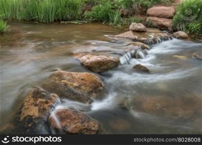 a trail crossing mountain creek with a row of step stones - Red Mountain Open Space, Colorado