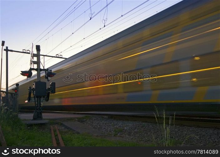 A train passing a railroad intersection at high speed