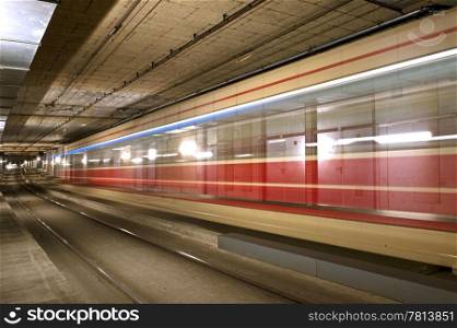 A tram disappearing into a tunnel