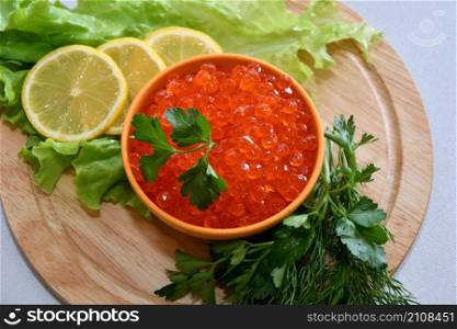A treat with red caviar and fresh herbs for Orthodox Christmas