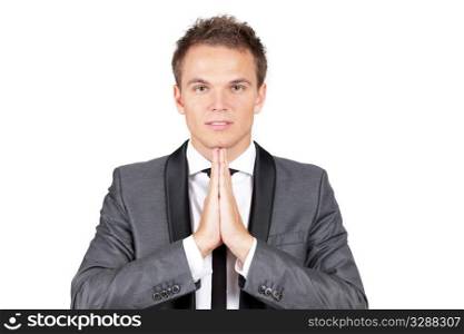 A trendy caucasian businessman making a prayer