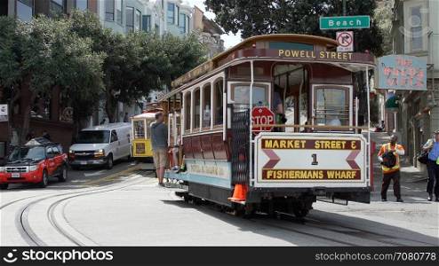 A Trolley Car loaded with passengers in San Francisco
