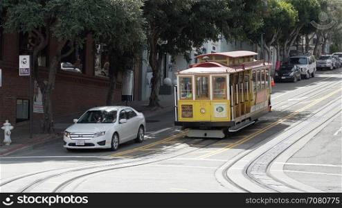 A Trolley Car takes passengers around the city of San Francisco