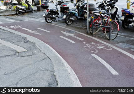 A two way well designated pink bike lane for increased traffic safety.