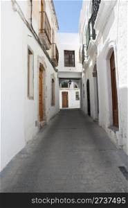 A typical Andalusian street with whitewashed houses. Nijar, a village in the province of Almeria (Spain).
