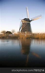 A typical Dutch windmill basking in the warm glow of the winter morning light
