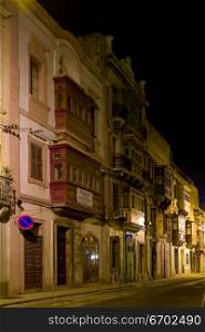 A typical Maltese street at night in Valetta, Malta.