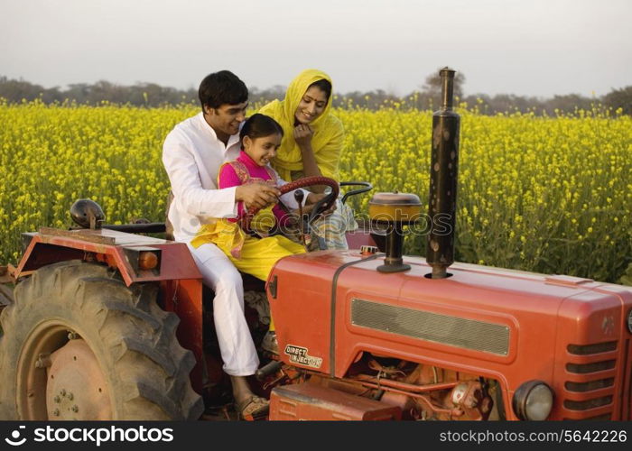 A typical rural family on a tractor