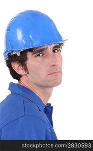 A unhappy manual worker.