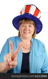 A US military wife wearing a patriotic party hat and flashing a peace sign. Isolated on white.