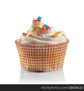 a vanilla cupcake decorated with stars on white