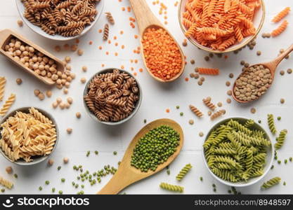 A variety of fusilli pasta made from different types of legumes, green and red lentils, mung beans and chickpeas. Gluten-free pasta.