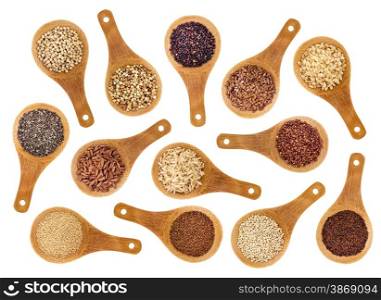 a variety of gluten free grains (buckwheat, amaranth, brown rice, millet, sorghum, teff, black, red, white and black quinoa, chia seeds, flax seeds) on wooden spoons isolated on white