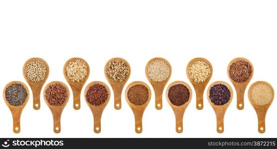 a variety of gluten free grains (buckwheat, amaranth, brown rice, millet, sorghum, teff, black, red, white and black quinoa, chia seeds, flax seeds) on wooden spoons isolated on white
