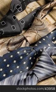 a variety of neckties knotted closeup