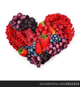 A variety of summer berries in the shape of heart as a symbol of valentine and love.