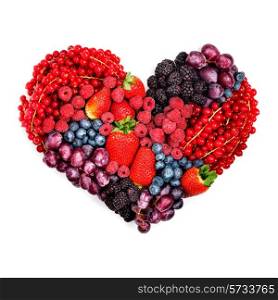 A variety of summer berries in the shape of heart as a symbol of valentine and love.