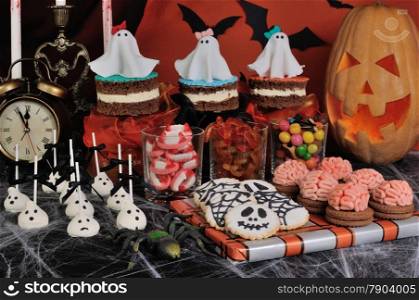 A variety of sweets on the table in honor of Halloween