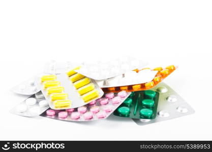 A variety of tablets in packs on white background