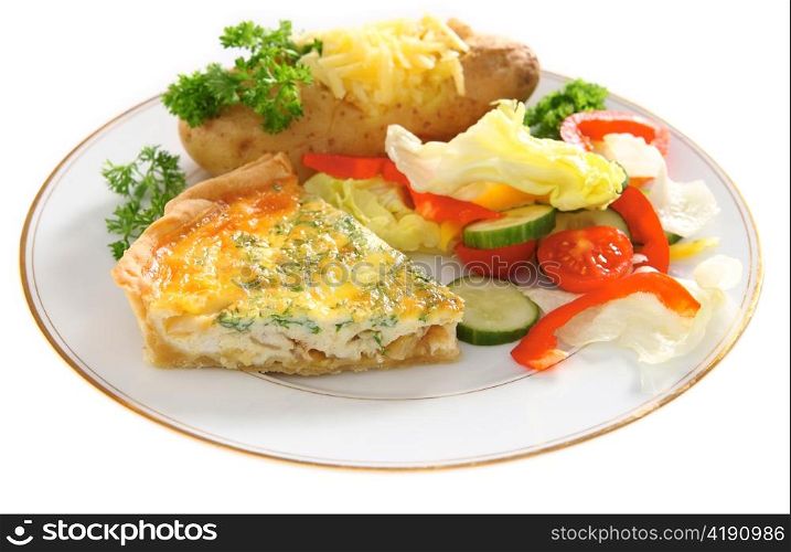 A vegetarian meal of homemade quiche with a baked potato and salad on a plate, high key.