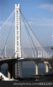 A vertical composition of an upright on the bay bridge off Treasure Island