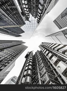 A vertical low angle shot of a modern business building scenery touching the sky. Vertical low angle shot of a modern business building scenery touching the sky