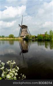 A vertical view of a historic 18-century windmill at Kinderdijk in South Holland