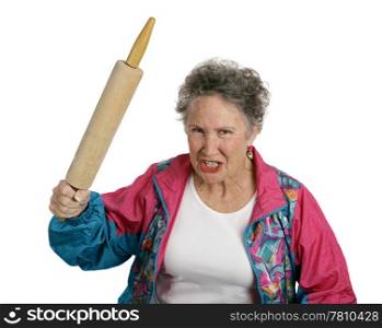 A very angry senior lady holding a rolling pin and threatening to whack someone with it (her husband?). Isolated on white.