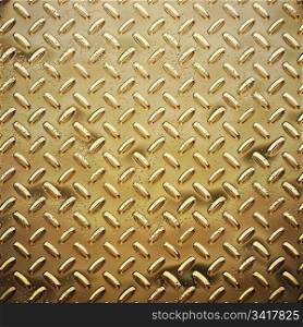 a very large sheet of roughened gold tread or diamond plate. rough gold diamond plate