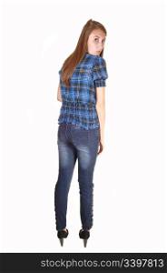 A very tall teenager in jeans and a chickened blue blouse, standing fromthe back and looking over her shoulder, for white background.