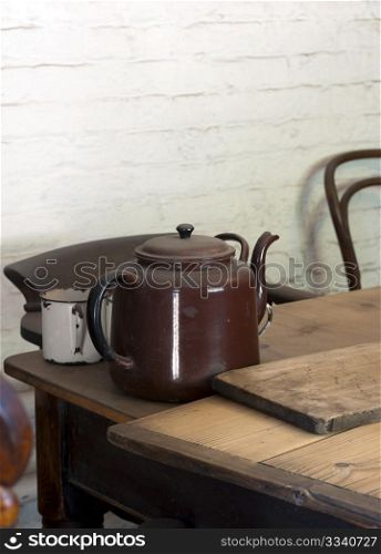 A Victorian Teapot On A Farmhouse Kitchen Table