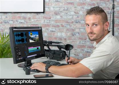 a video editor with computer and professionnal video camera