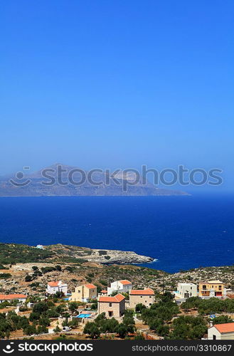 A view across the north Crete tourist holiday homes at Kokkino Horio in Apokoronos over Souda Bay to the Akrotiri peninsula. The area is awash with British and other north European settlers who have all moved in to new homes since about 2000,