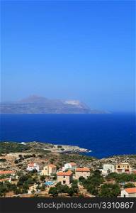 A view across the north Crete tourist holiday homes at Kokkino Horio in Apokoronos over Souda Bay to the Akrotiri peninsula. The area is awash with British and other north European settlers who have all moved in to new homes since about 2000,
