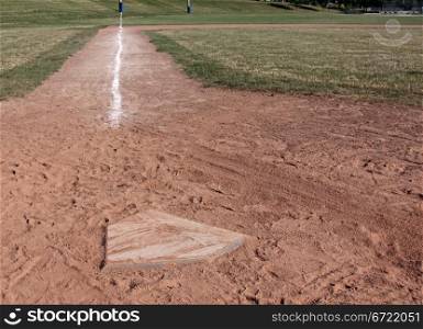 A view down the left field line of a baseball field shot from home plate.. Home Plate Left Side
