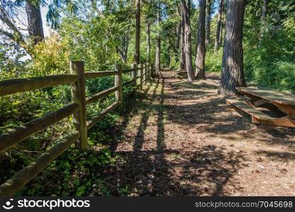 A view of a path next to a wooden fence at Dash Point State Park in Washington State.